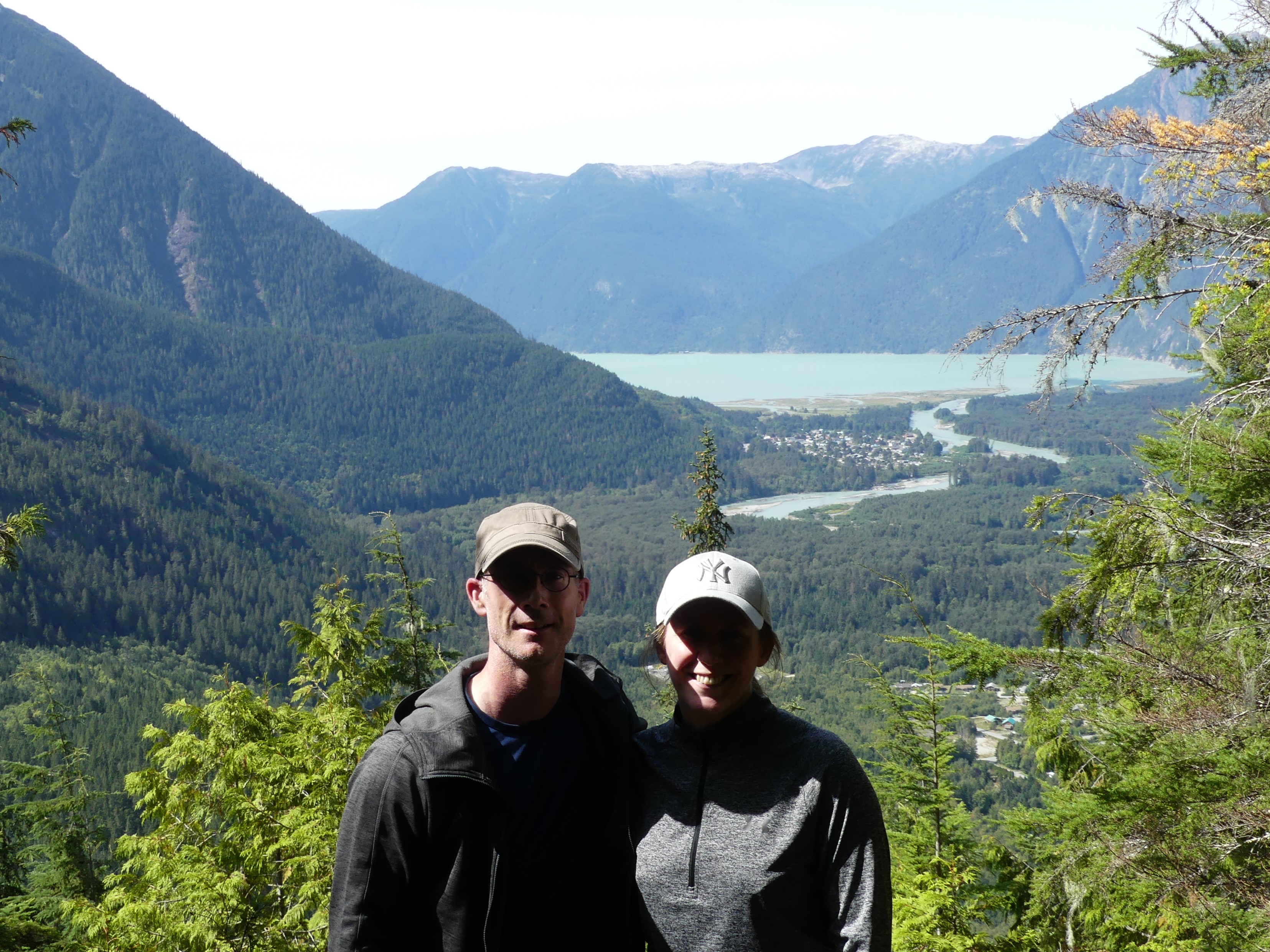 James D. McEwan and his wife with the lush Bella Coola valley in the background